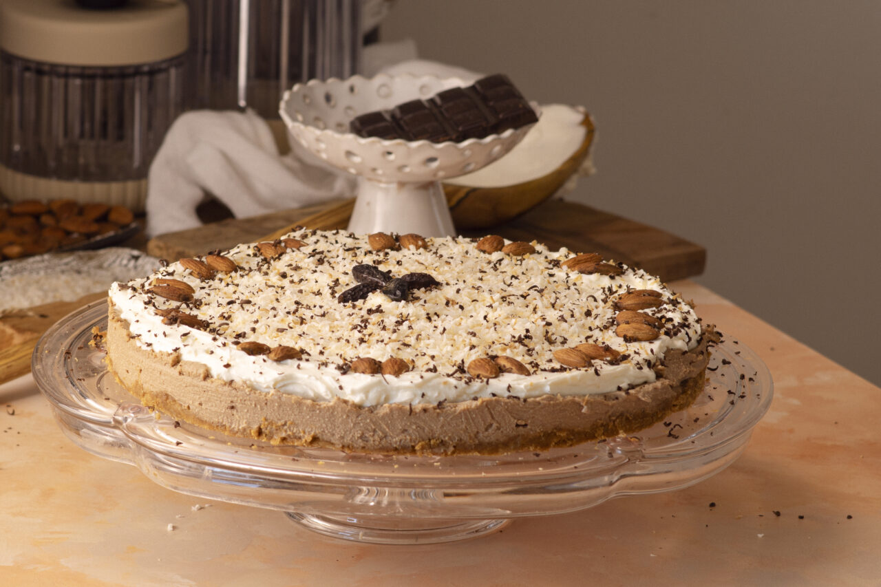 No-bake coffee cheesecake with double chocolate, decorated with toasted coconut and shaved chocolate
