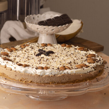 No-bake coffee cheesecake with double chocolate, decorated with toasted coconut and shaved chocolate