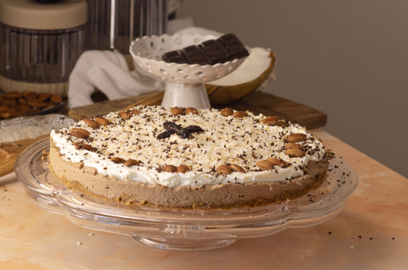 No-bake coffee cheesecake with double chocolate, decorated with toasted coconut and shaved chocolate