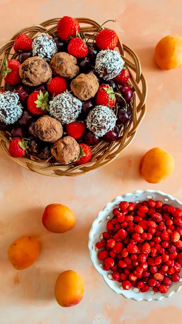 The ultimate chocolate truffles’ recipe!🍫These happen to be plant-based as well (not completely vegan because of the small amount of honey), but this is not even the main point here. Hearty, filling, dark, coconutty, and with an unexpected crunch inside them.  Perfect for your next fruit board. Save this for your next sweet cravings! 🍒  Coconut Chocolate Truffles with Dark Chocolate Chunks 🥥  INGREDIENTS  * 225 g quality dairy-free dark chocolate (the best is 55-65% cocoa)
* 150 g organic coconut milk, well shaken before opening
* 2 teaspoons runny or melted honey
* 25 g (organic) extra virgin coconut oil
* 50 g high-quality ultra-dark chocolate (ideally 90% cocoa, but anything from 70% works well)
* Unsweetened cocoa powder and desiccated coconut, for coating  INSTRUCTIONS  If you’re using regular chocolate bars rather than chocolate nibs or chips, break the first two chocolates into small pieces and place them in a heatproof bowl.  Heat the coconut milk with the honey to about 40-50°C (104-122°F), then pour it over the chocolate. Whisk until the chocolate has completely melted and the mixture is smooth.  Add the coconut oil, melted and therefore heated a bit beforehand on the stovetop or in the microwave, and whisk until the mixture becomes glossy and fully combined. Leave it to cool to room temperature.  Meanwhile, finely chop the darkest chocolate into small pieces. If you’re using chocolate nibs or small chips, you can leave them as they are.  Once the chocolate mixture has cooled completely, fold in the chopped chocolate or nibs to create a nice crunch in the truffles. Refrigerate for up to 1 hour, or until firm enough to scoop.  Using a teaspoon, scoop small portions of the mixture and roll them between your hands to form bite-sized truffles. Roll each truffle in unsweetened cocoa powder or desiccated coconut until evenly coated.  Store the truffles in the refrigerator. For the best flavor and texture, let them sit at room temperature for about 30 minutes before serving.  #chocolatetruffle #nobakedessert #healthycomfortfood #plantbasedsweets #dairyfreerecipes
